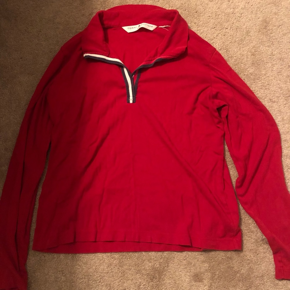 This long sleeve collared red shirt has no size tag, but fits like a medium.